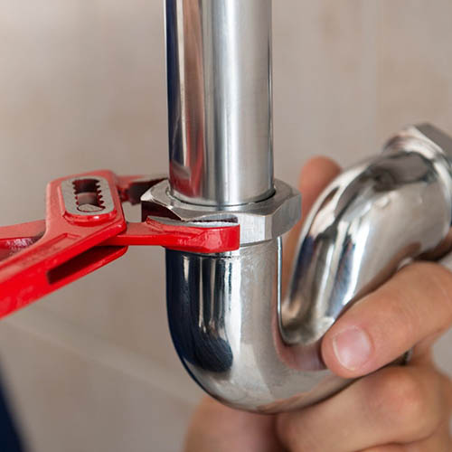 Plumber Fixing Pipe